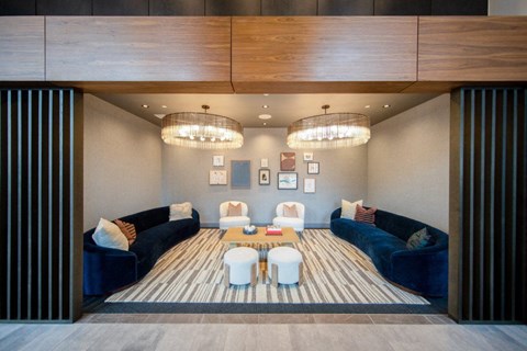 a living room with couches and chairs and a table