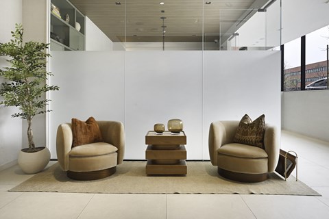 Two chairs and a table in the lobby