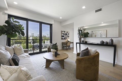 A living room with a brown chair and a coffee table.