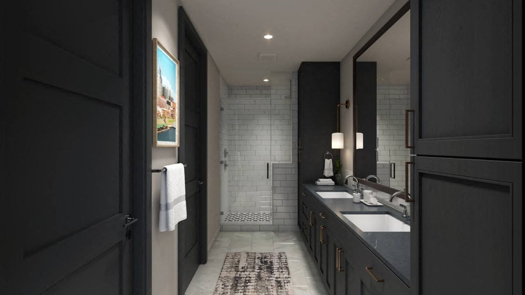 Luxurious bathroom in a dark finish palette at The Everett Nashville Yards