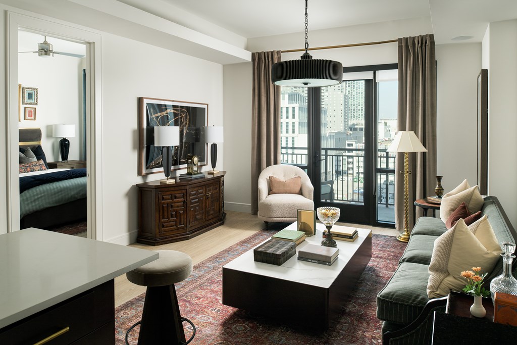 A living room with a green couch and a coffee table.