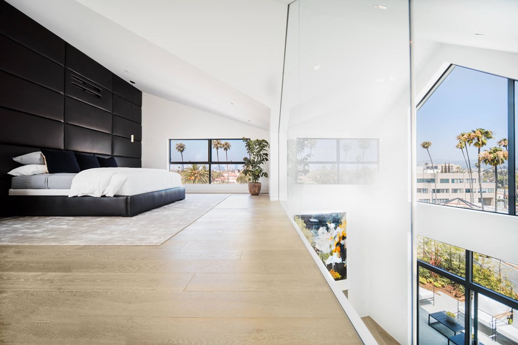 loft style bedroom with glass partition
