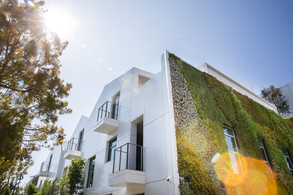 exterior photo featuring corner with living wall