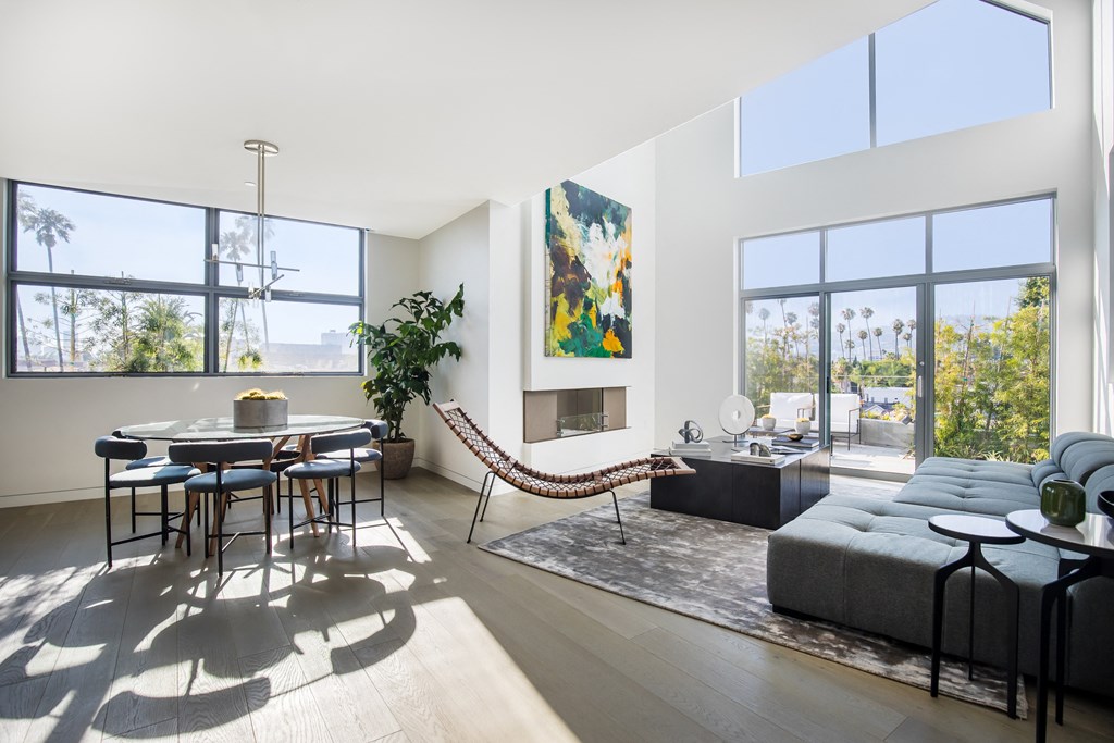 a rendering of a living room with a couch and a dining table