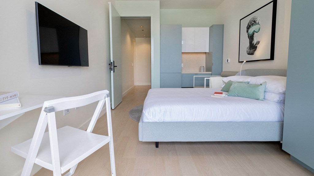 bedroom with built-in desk Sentral Beverly Hills apartments