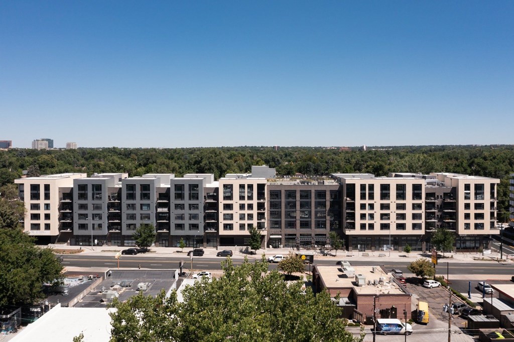 A large building with a parking lot in front of it.