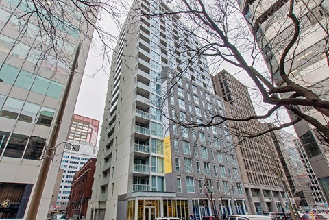 a view of a tall building on a city street