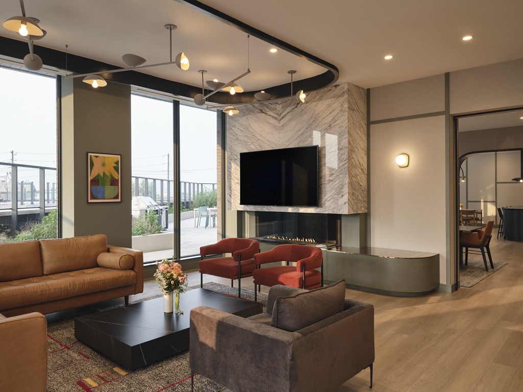 A living room with a fireplace and a flat screen TV.