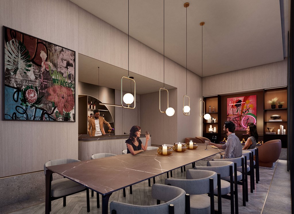 a large dining room with people sitting at a long table