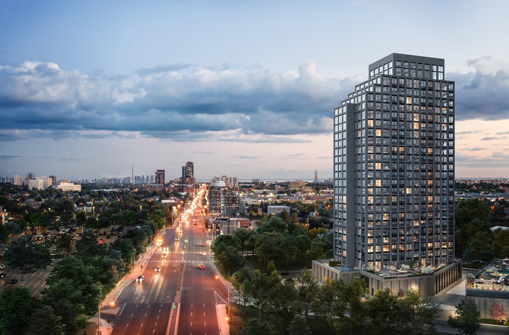 an aerial view of a skyscraper overlooking a city at dusk