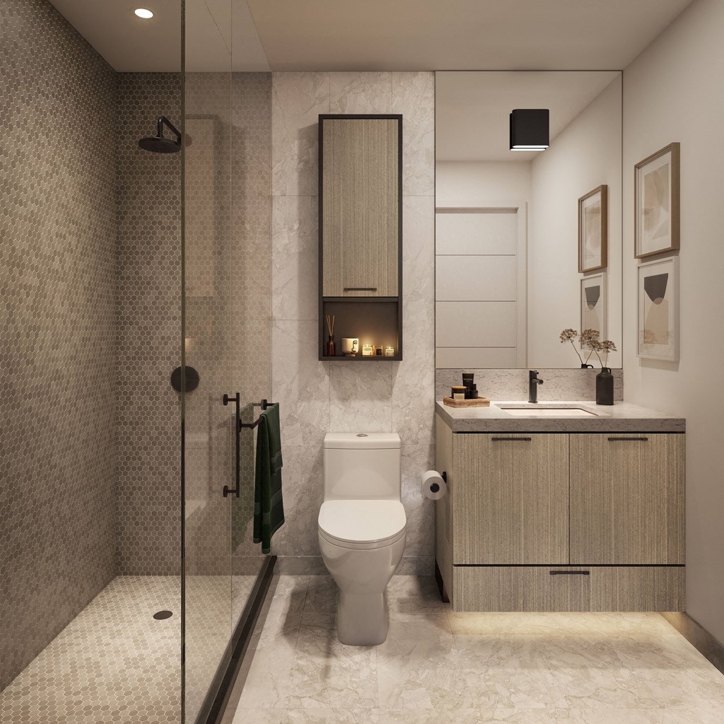 a bathroom with a toilet and a sink and a shower