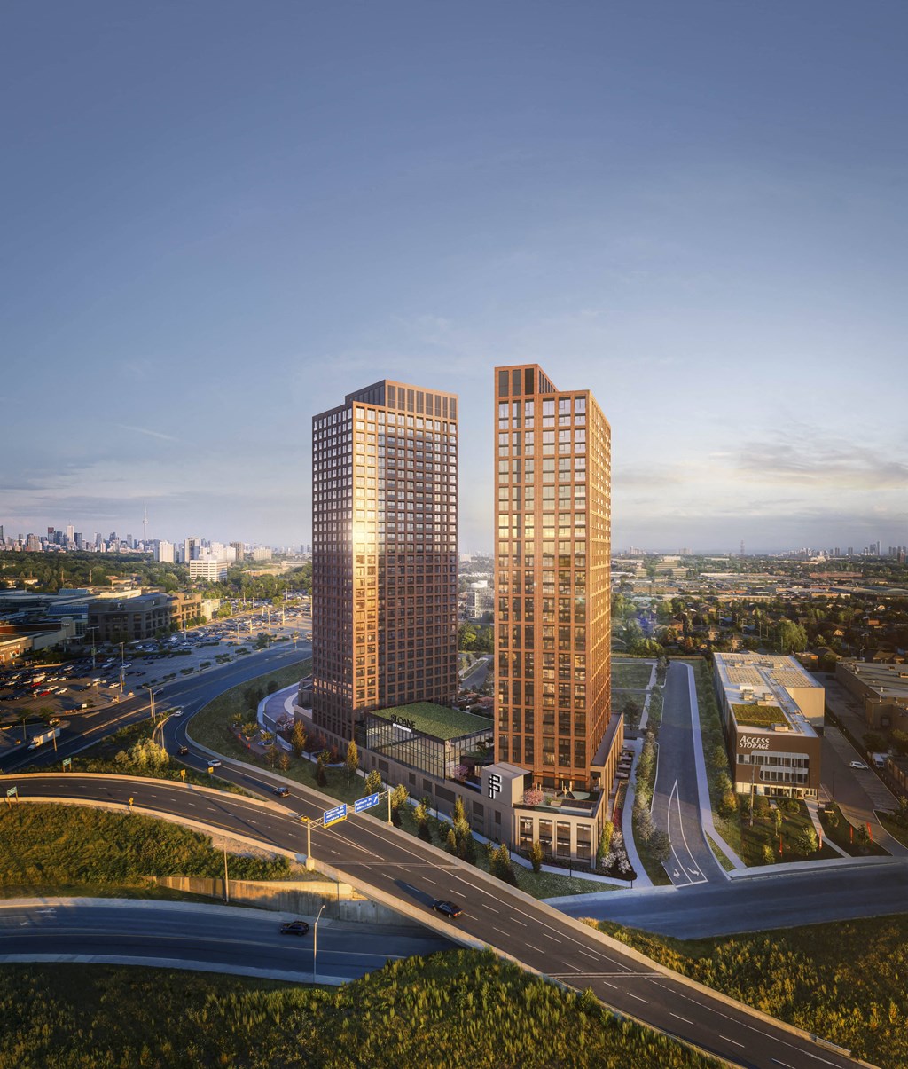 two tall skyscrapers next to a highway in a city