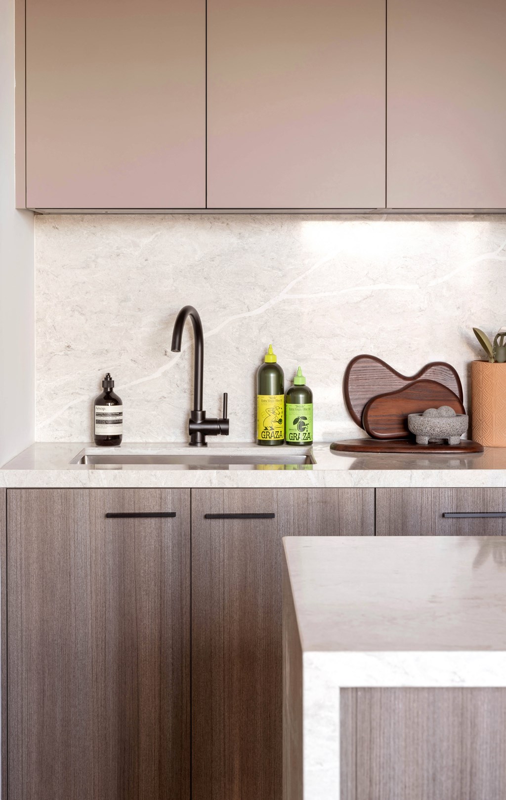 a kitchen with wooden cabinets and a sink