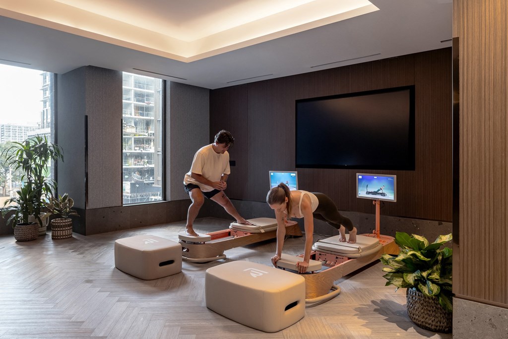 two people are working on luggage in a living room