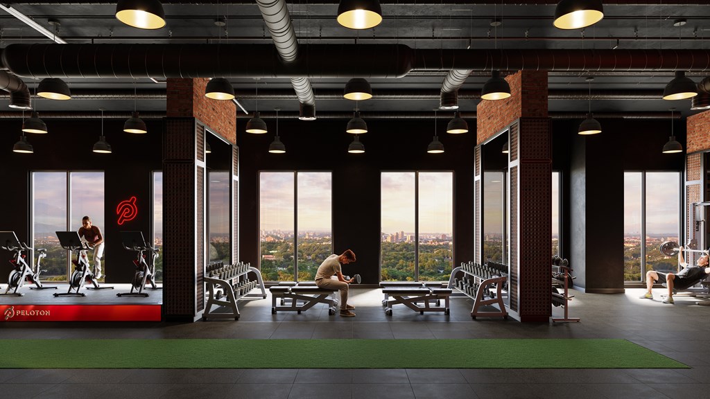 A gym with a view of the city outside the windows.