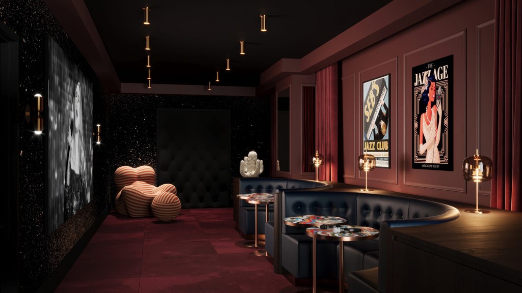 A dark room with a red carpet and a wall with a picture of a woman.