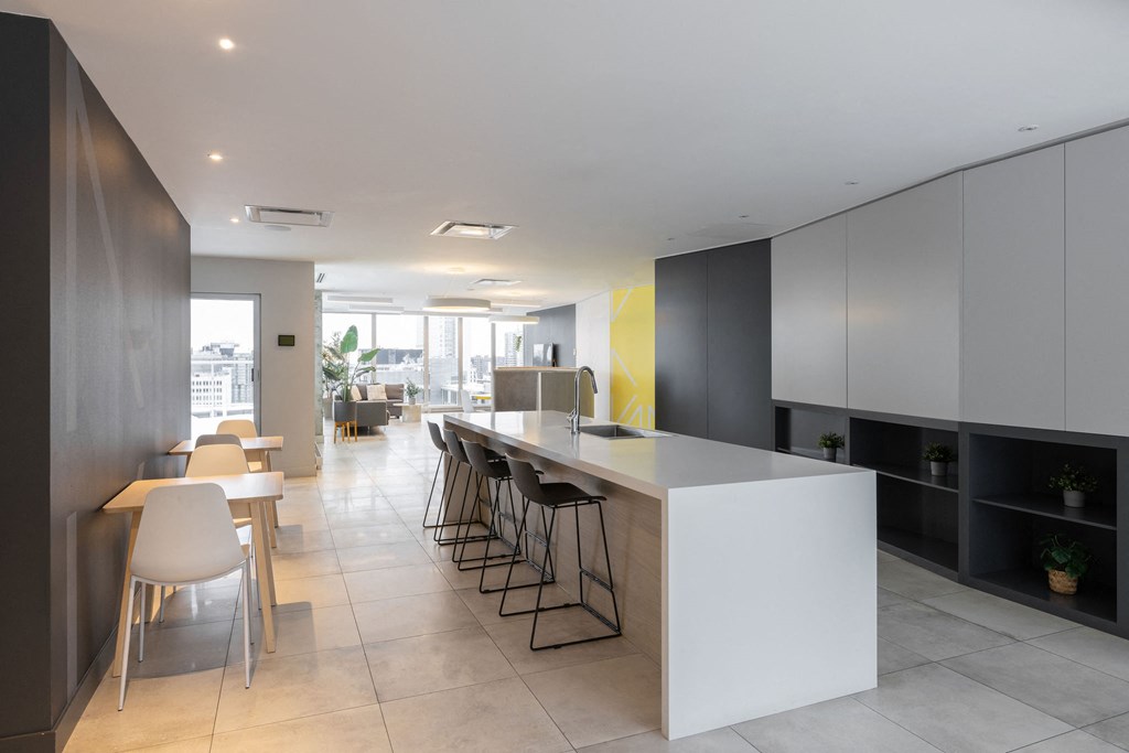 Shared area with a counter, tables and chairs