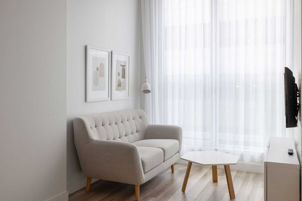 a small living room with a couch and a coffee table