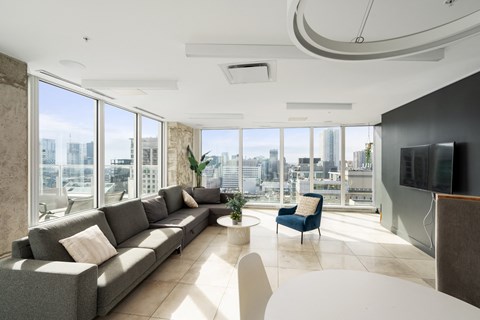 a living room with a couch and a table and a television