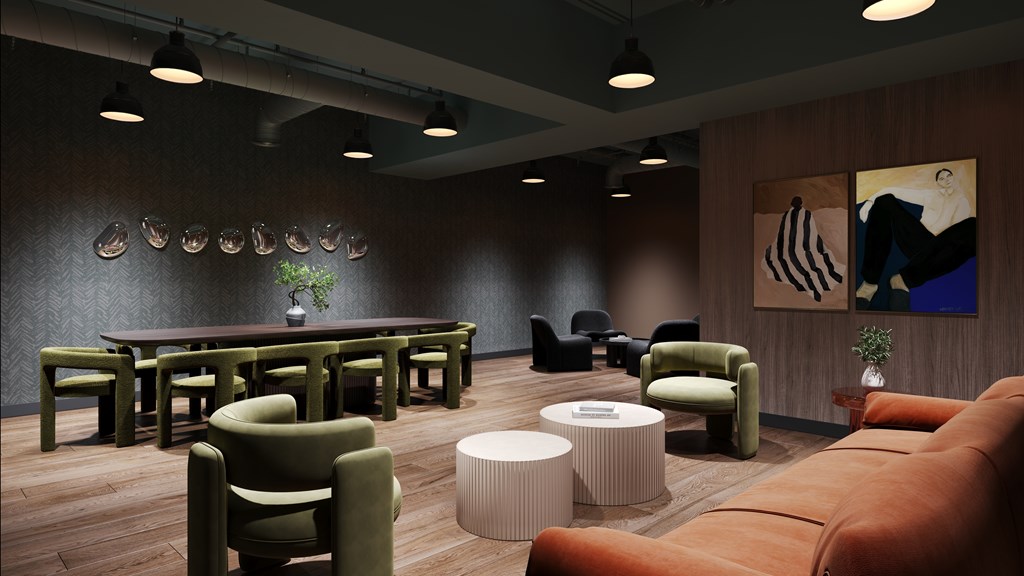 A room with a long table and chairs.