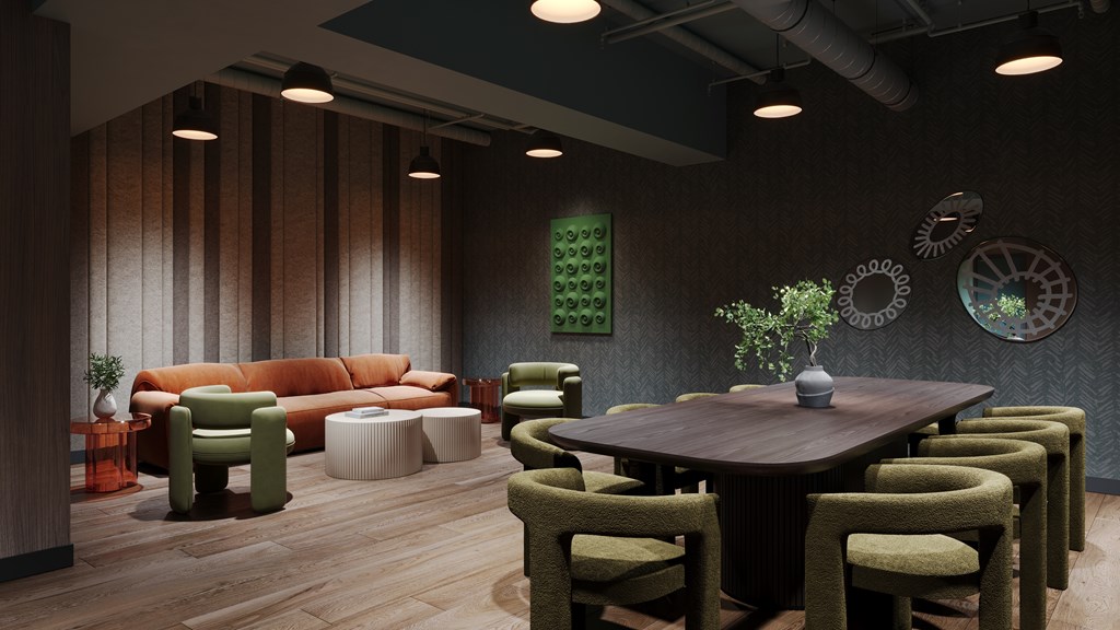 A modern dining room with a wooden table and green chairs.