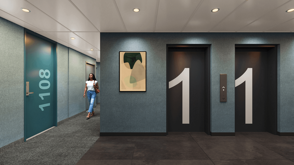 A woman is standing in front of elevator doors numbered 1101.