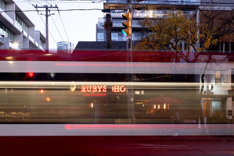 Ruby's Den is a restaurant with a red awning.