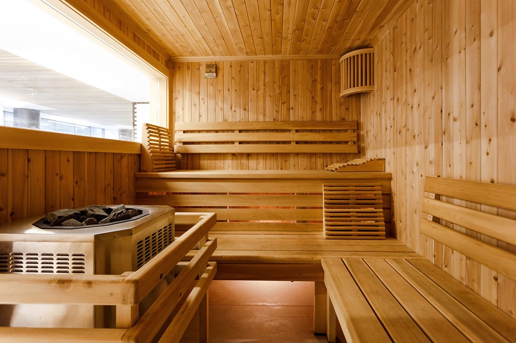 a sauna with wooden walls and a table