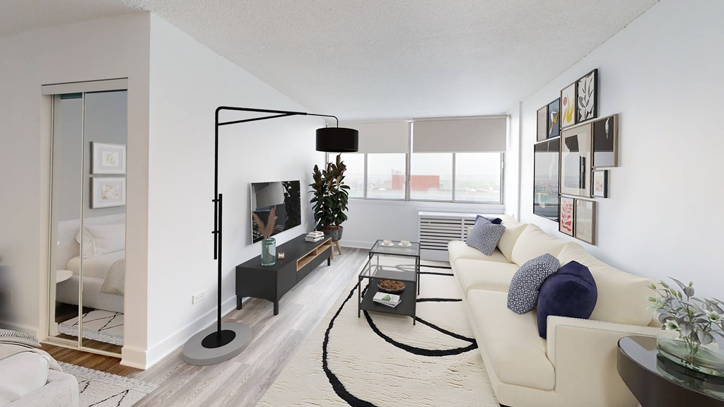 A modern living room with a white couch and a black floor lamp.