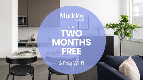 A modern kitchen with a sign offering two months free of Maddox Tyndall.
