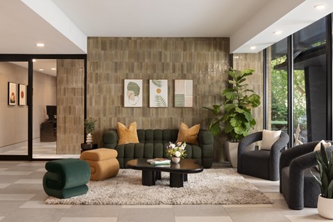 A living room with a green couch and a coffee table.