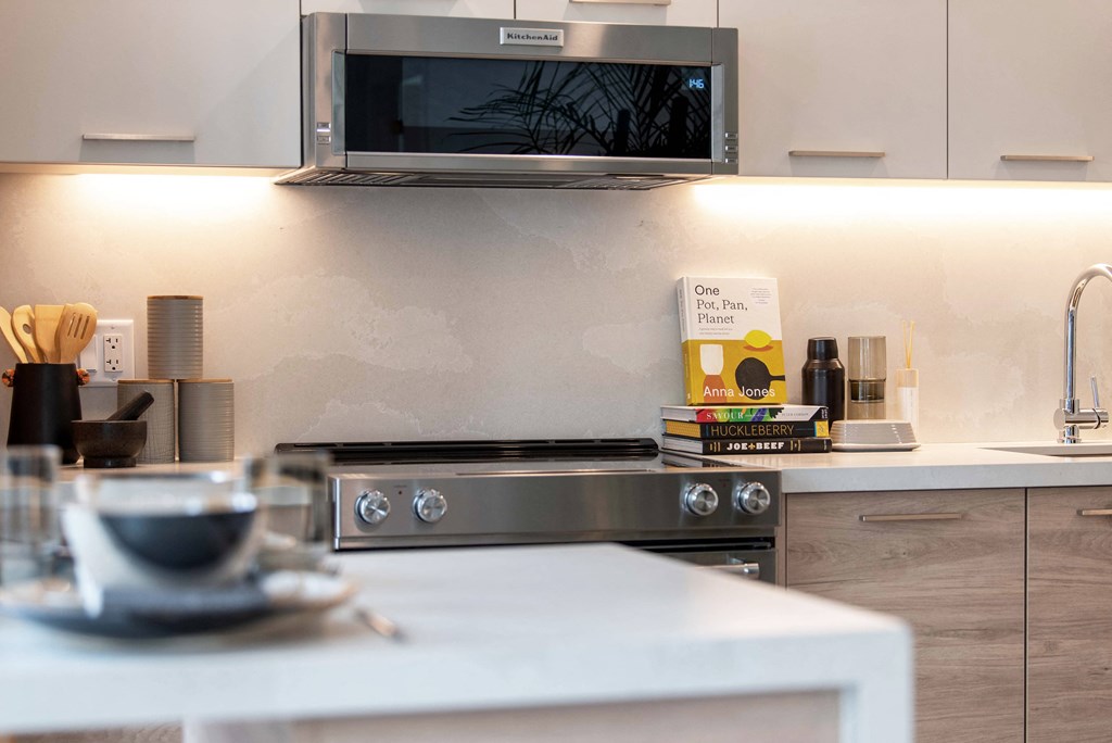 Quartz Islands and Countertops with Slab Backsplashes