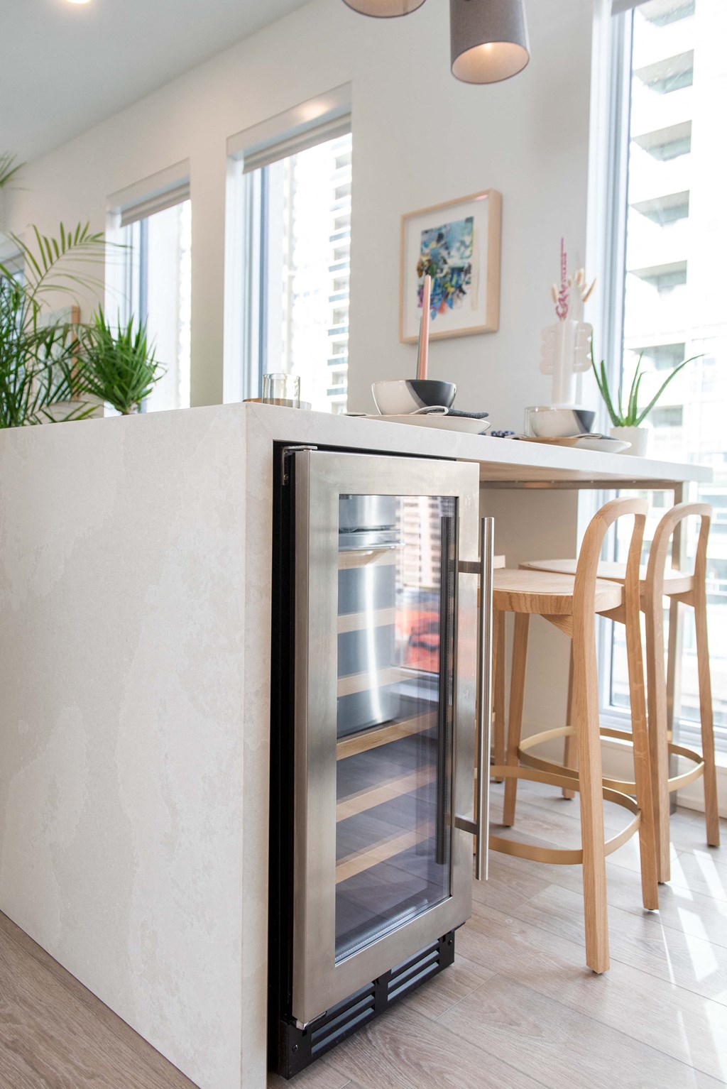 Custom Waterfall Quartz Islands with Wine Fridges