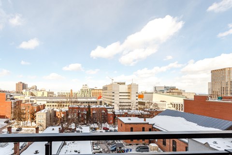 the view of the city from the roof of a building