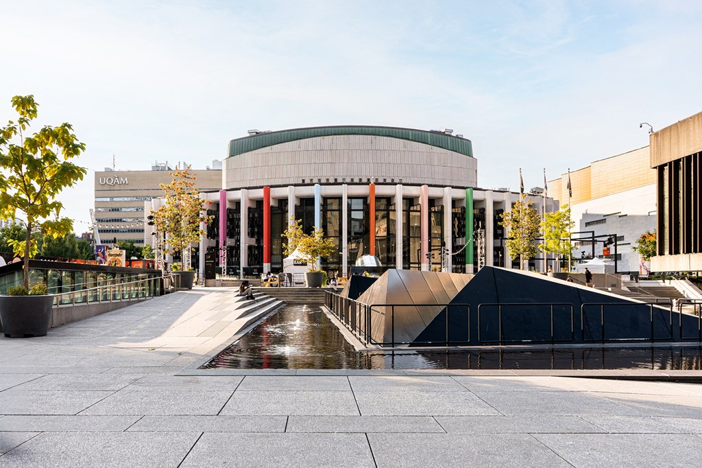 a large building with a fountain in front of it