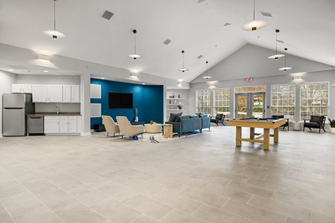 the preserve at ballantyne commons clubhouse with a billiards table and kitchen