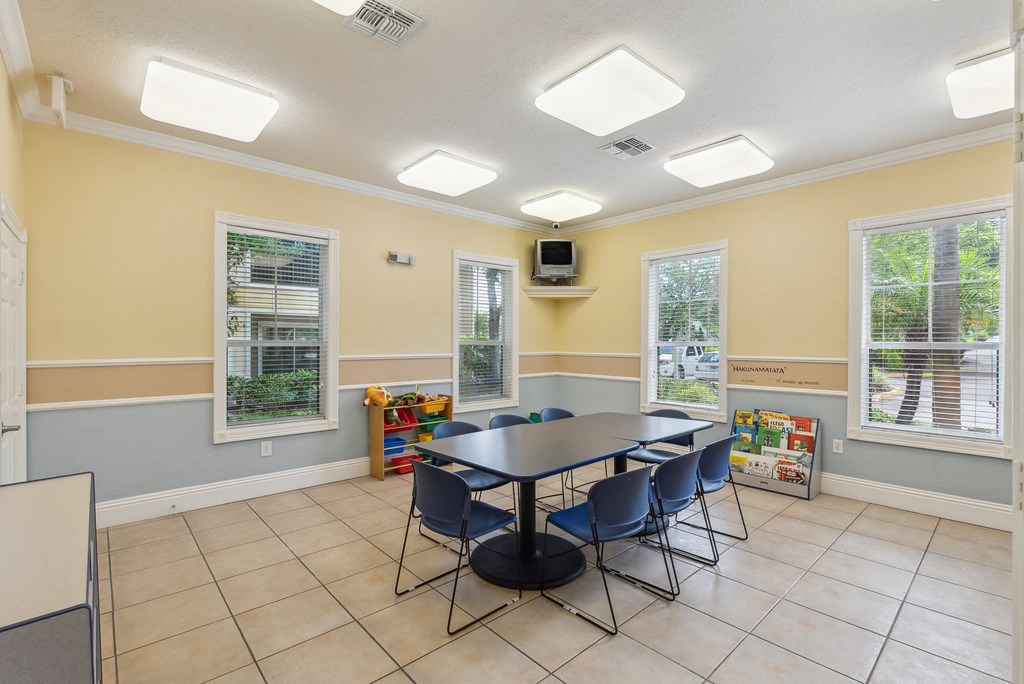 a room with a table and chairs