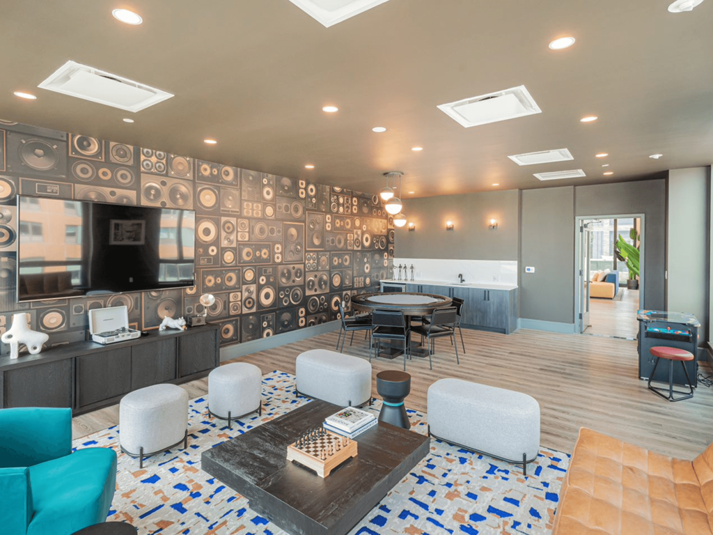 Media and Game Room with Poker Table and Arcade Games at One East Harlem Luxury Apartments in East Harlem, NY