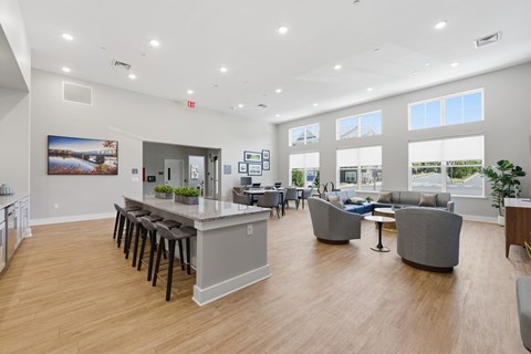 A spacious open plan office with a kitchen area and a dining area.