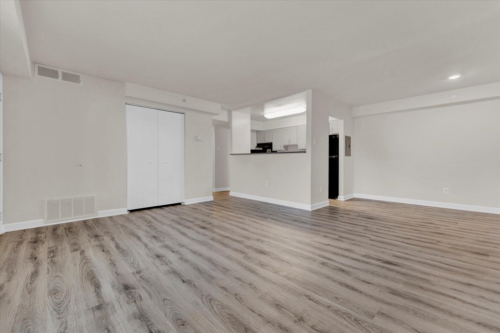 Bedroom with hardwood floors and white walls at Autumn Woods, Bladensburg, 20710