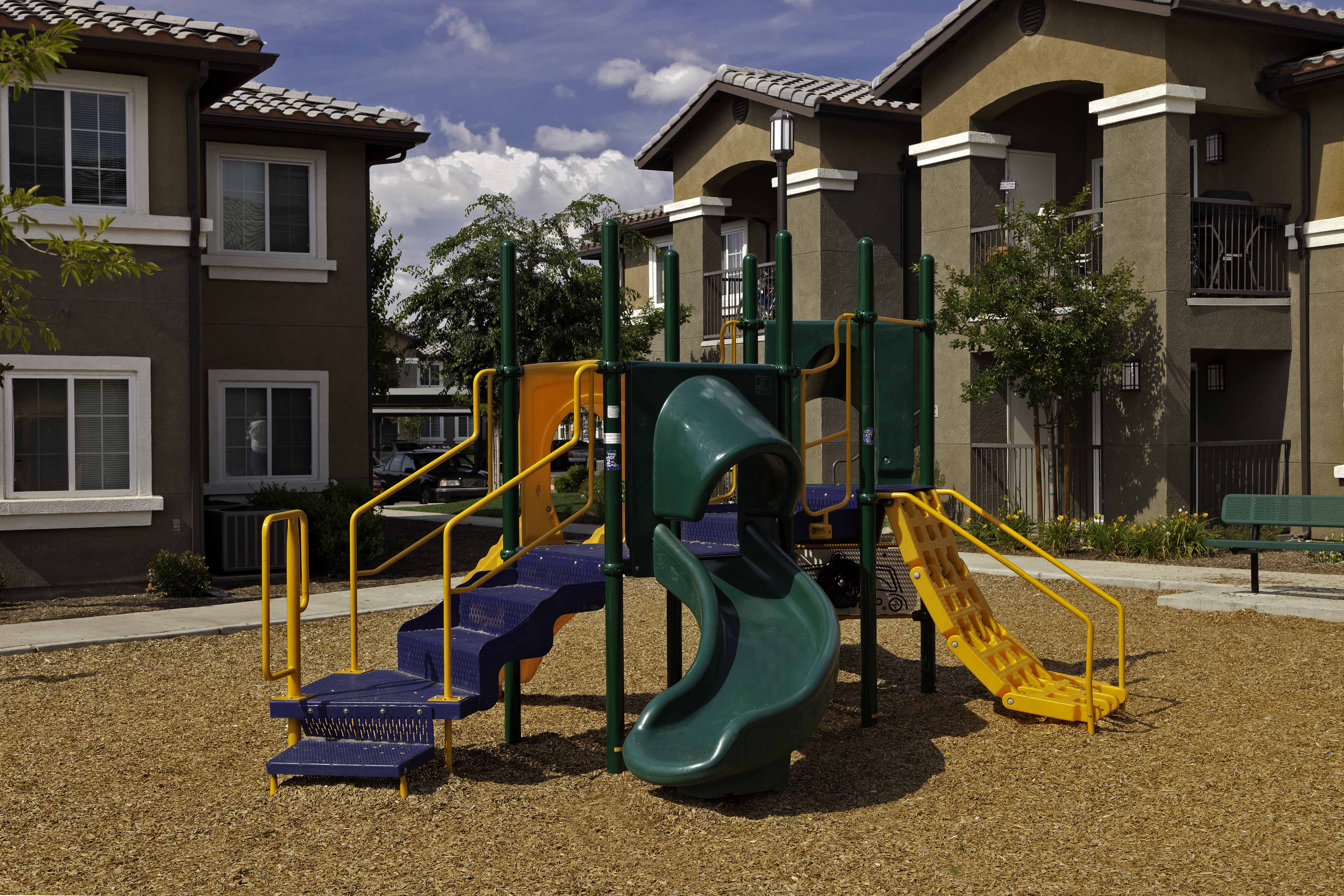 a playground at the whispering winds apartments in pearland, tx