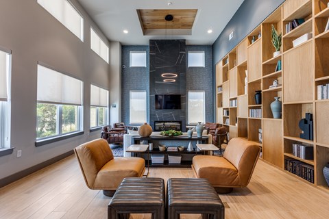 A modern living room with a fireplace and a large window.