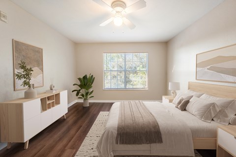 A bedroom with a large bed and a window.