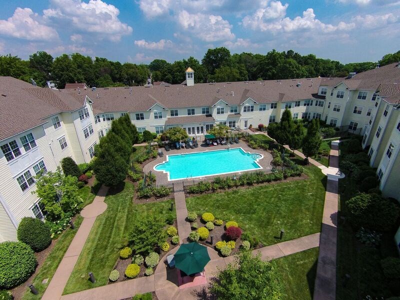 Garden Courtyard and Swimming Pool at The Kentshire Senior Apartments in Midland NJ