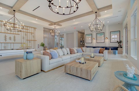 a large living room with couches and tables