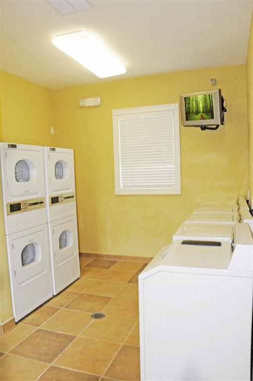 a kitchen with two washes and a dryer in it