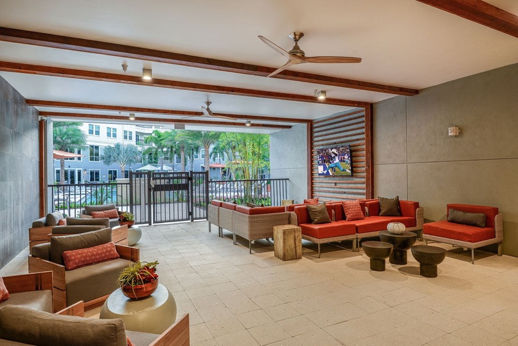 a lobby with couches and chairs and a balcony at Grady Square, Tampa, 33607