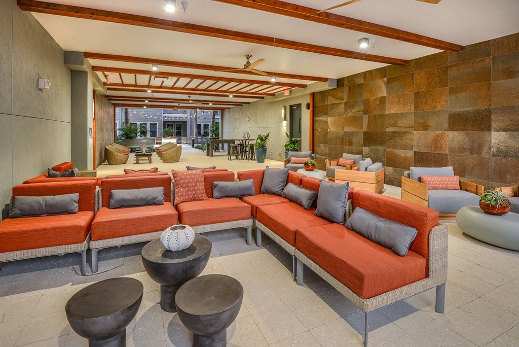 the living room has couches and tables and a large patio at Grady Square, Tampa, FL