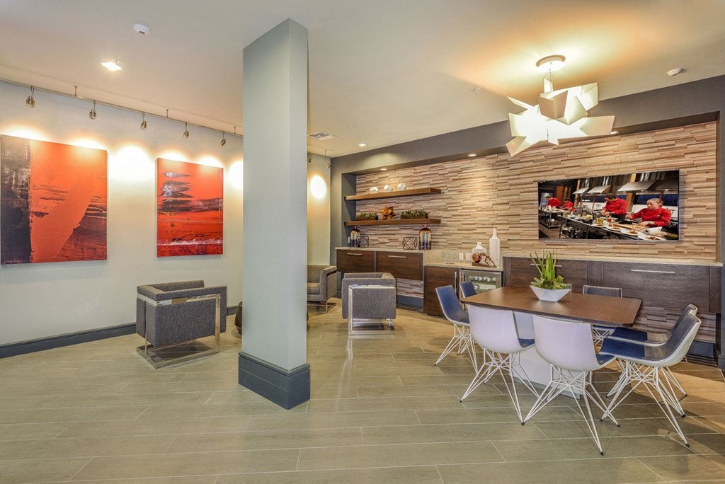the lobby of a restaurant with tables and chairs  at Grady Square, Tampa