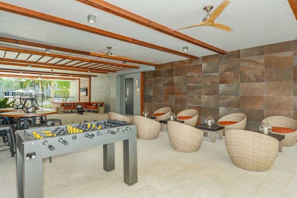 a games room with a foosball table and chairs  at Grady Square, Tampa, Florida